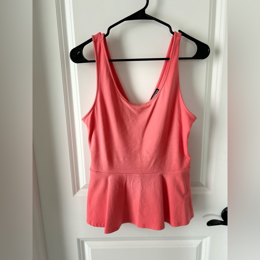 Coral colored peplum top from Express